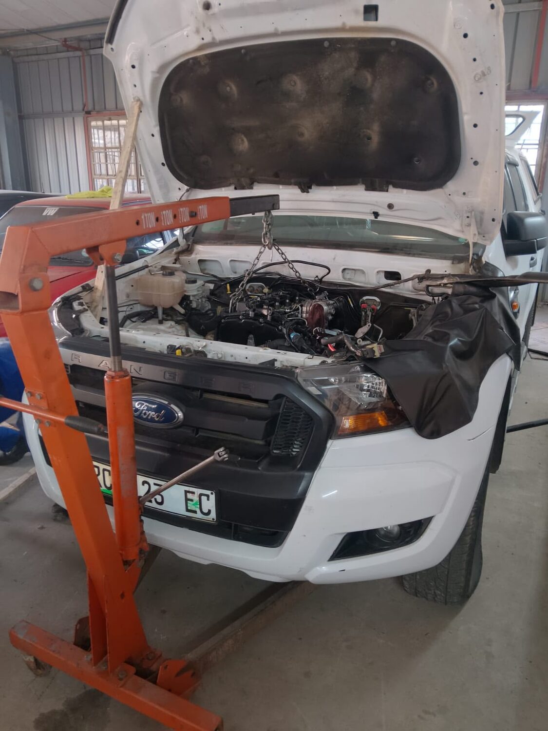 Ford Ranger undergoing a complex mechanical repair